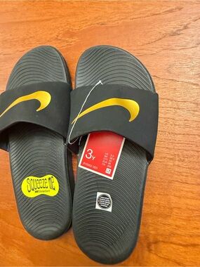 Nike Kids Black and Gold Slide Sandals